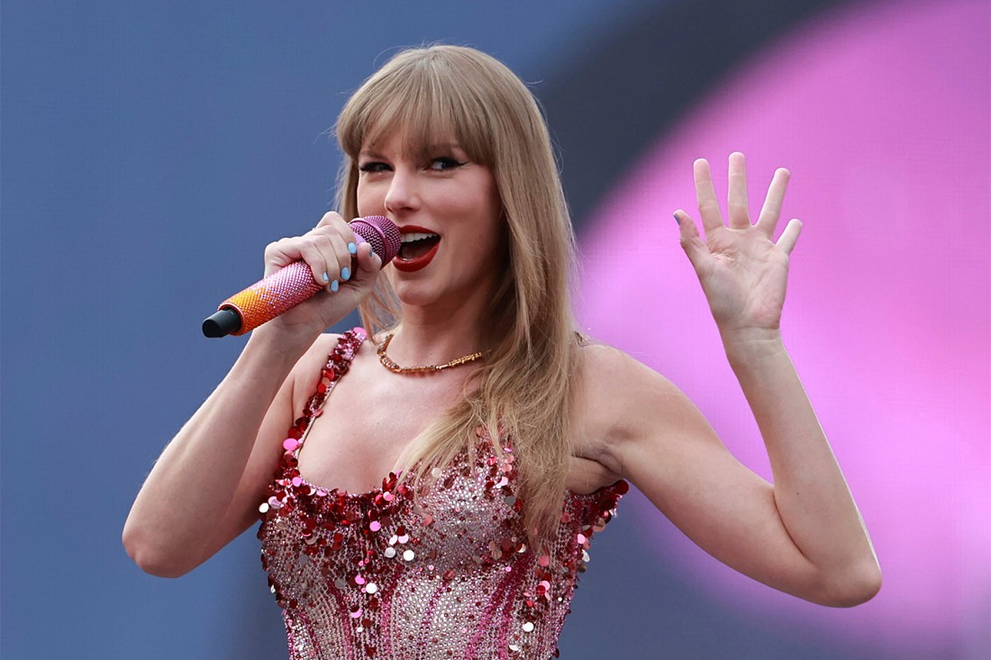 Photo of pop star Taylor Swift singing during a concert.