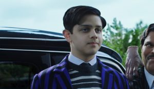 L to R: Isaac Ordonez as Pugsley Addams, Thing, Luis Guzmán as Gomez Addams in 'Wednesday' Season 2 Part 2