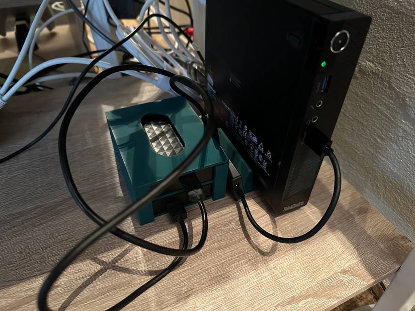 A mini-PC Plex server with 3D printer stand and HDD caddy.