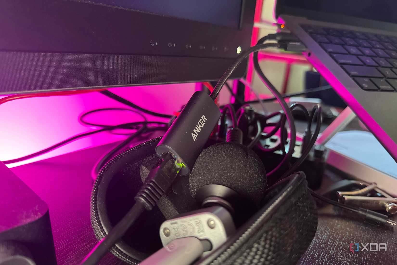 Anker brand Ethernet to USB-C adapter plugged into a MacBook Pro