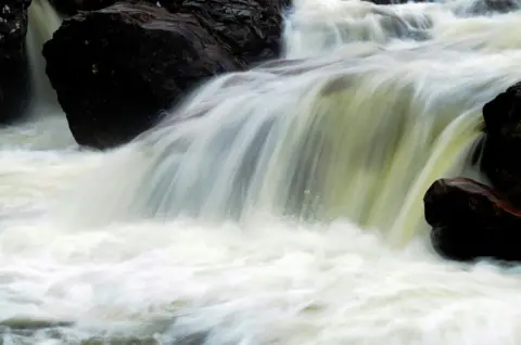 Stephen Hollas Slow shutter speed image of a waterfall giving a smokey/blurred effect 