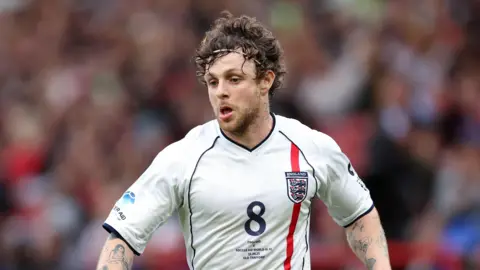 Getty Tom Grennan wearing an England shirt while playing at Soccer Aid 2025