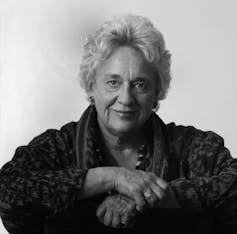 A woman smiling.
