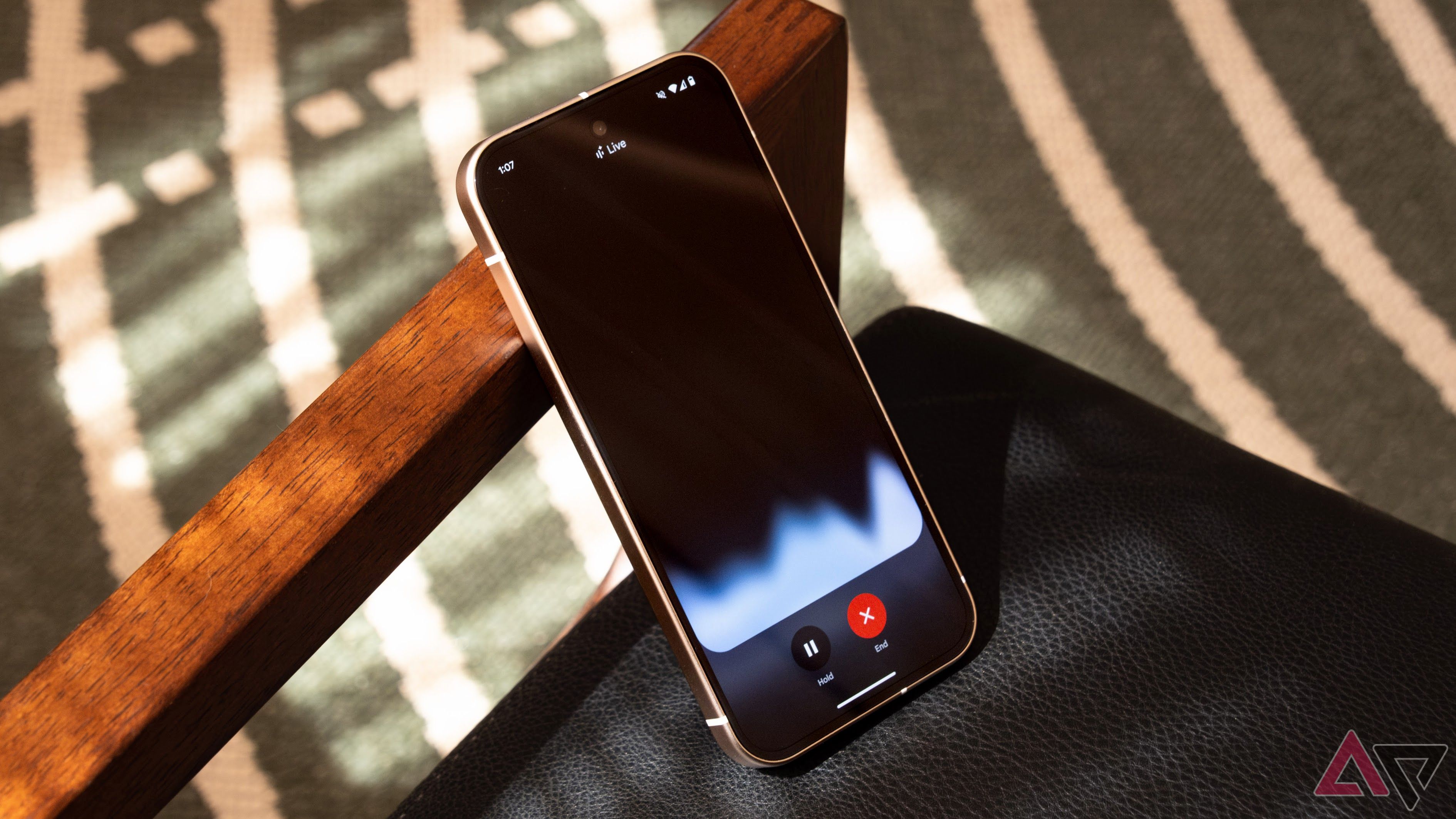 Gemini Live running on a Pixel 9 phone in a leather armchair.