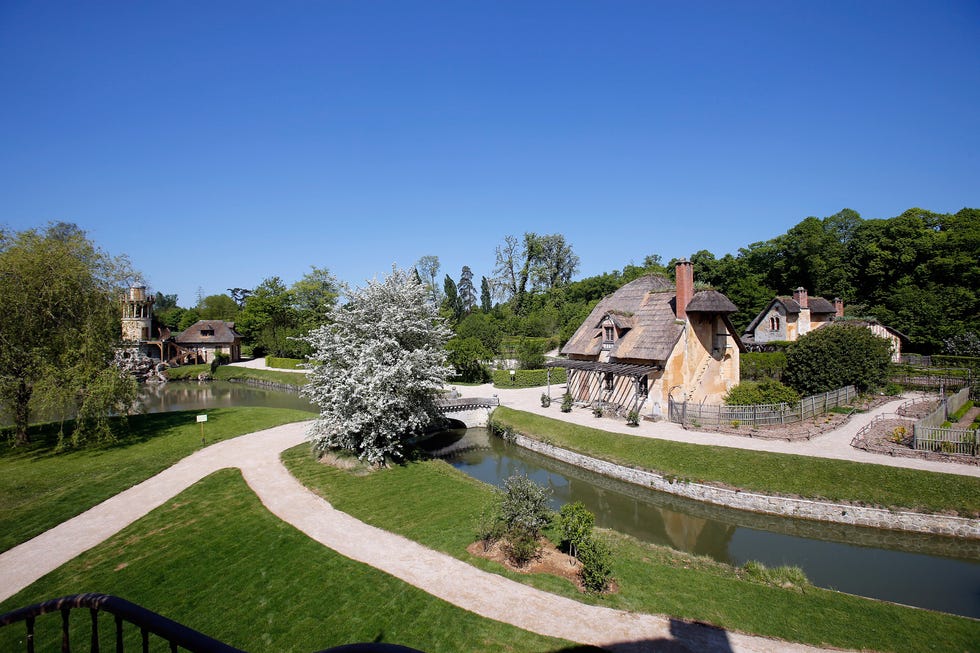 versailles, france may 04: the colombier is visible in the garden of "le hameau de la reine" (the queen's hamlet) during its opening to the public after restoration, at the versailles palace on may 4, 2018 in versailles, france. the hamlet of the queen built by richard mique for marie antoinette between 1783 and 1787 is an outbuilding of the petit trianon located in the park of the palace of versailles. this hamlet was commissioned during the winter of 1782 1783 by queen marie antoinette who wanted to move away from the constraints of the court of versailles. (photo by chesnot/getty images)