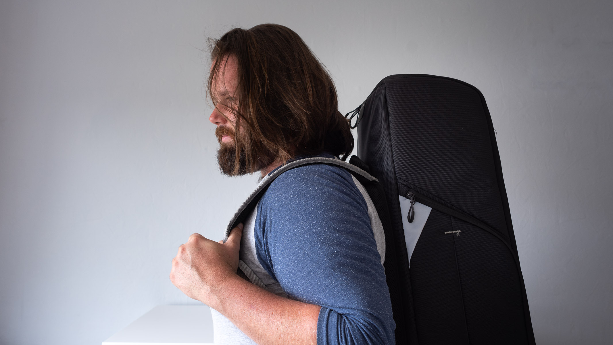 Author carrying backpack with telescope inside