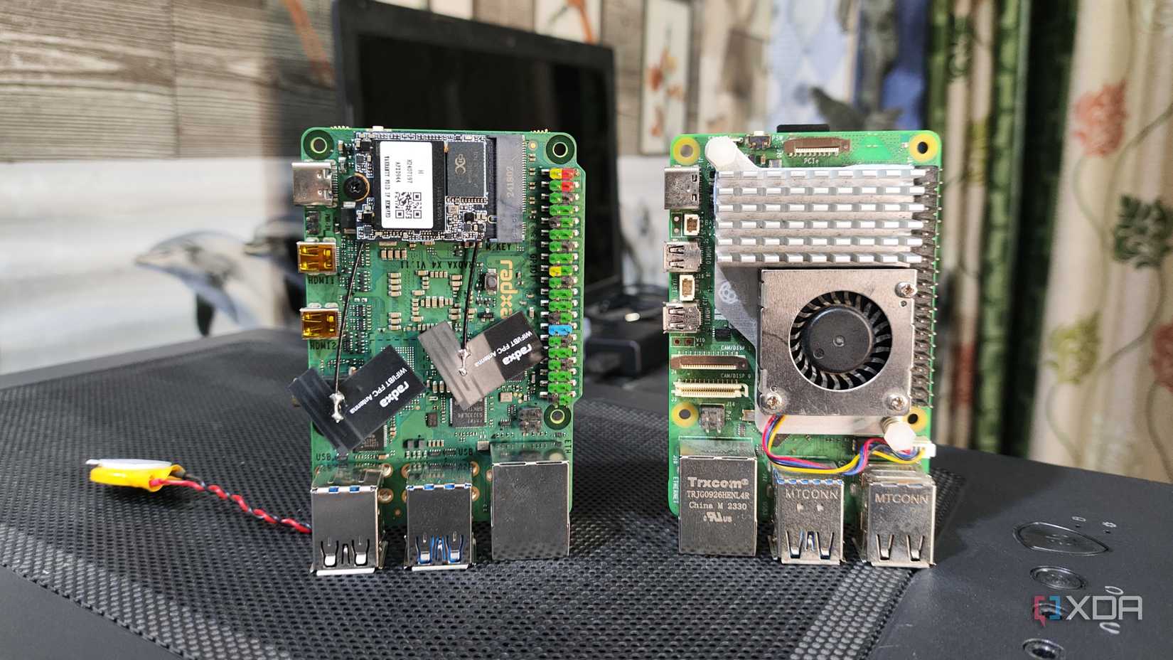 A Radxa X4 placed next to a Raspberry Pi 5