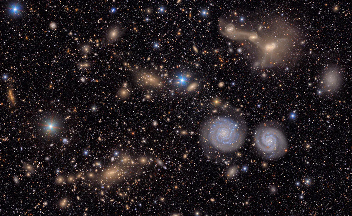 A small section of NSF-DOE Vera C. Rubin Observatory's total view of the Virgo cluster. Visible are two prominent spiral galaxies, three merging galaxies, several groups of distant galaxies and many stars in the Milky Way galaxy. Credit: NSF-DOE Vera C. Rubin Observatory