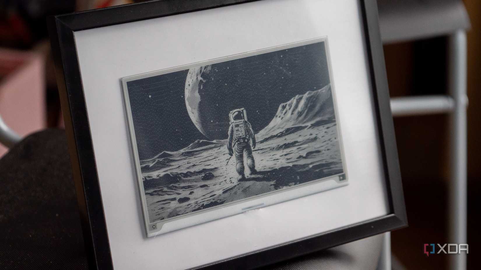 Seeed Studio TRMNL DIY kit showing a TRMNL image with an Astronaut on the panel
