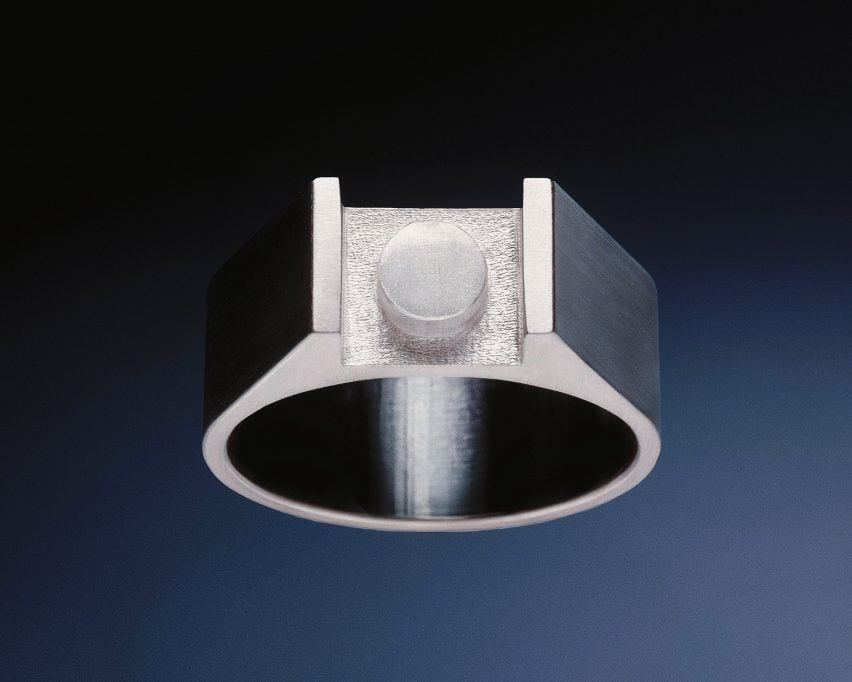Silver rings with central plate shaped like Lego tile. Photo courtesy of Anna Hadaier
