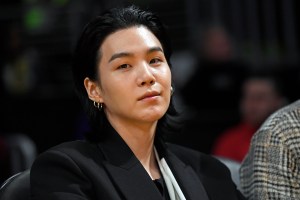 LOS ANGELES, CA - JANUARY 12: Suga, a member of the South Korean band BTS, attends the Los Angeles Lakers and Dallas Mavericks game at Crypto.com Arena on January 12, 2023 in Los Angeles, California. NOTE TO USER: User expressly acknowledges and agrees that, by downloading and or using this photograph, User is consenting to the terms and conditions of the Getty Images License Agreement. (Photo by Kevork Djansezian/Getty Images)