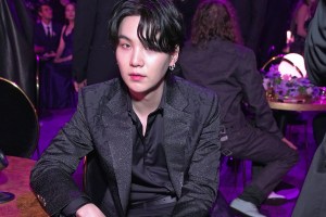 LAS VEGAS, NEVADA - APRIL 03: Suga of BTS poses during the 64th Annual GRAMMY Awards at MGM Grand Garden Arena on April 03, 2022 in Las Vegas, Nevada. (Photo by Kevin Mazur/Getty Images for The Recording Academy)