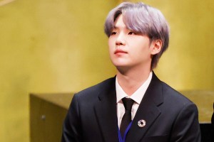 NEW YORK, NEW YORK - SEPTEMBER 20: Suga listens as Taehyung/V of South Korean boy band BTS speaks at the SDG Moment event as part of the UN General Assembly 76th session General Debate in UN General Assembly Hall at the United Nations Headquarters on Monday, September 20, 2021 in New York City.     (Photo by John Angelillo-Pool/Getty Images)