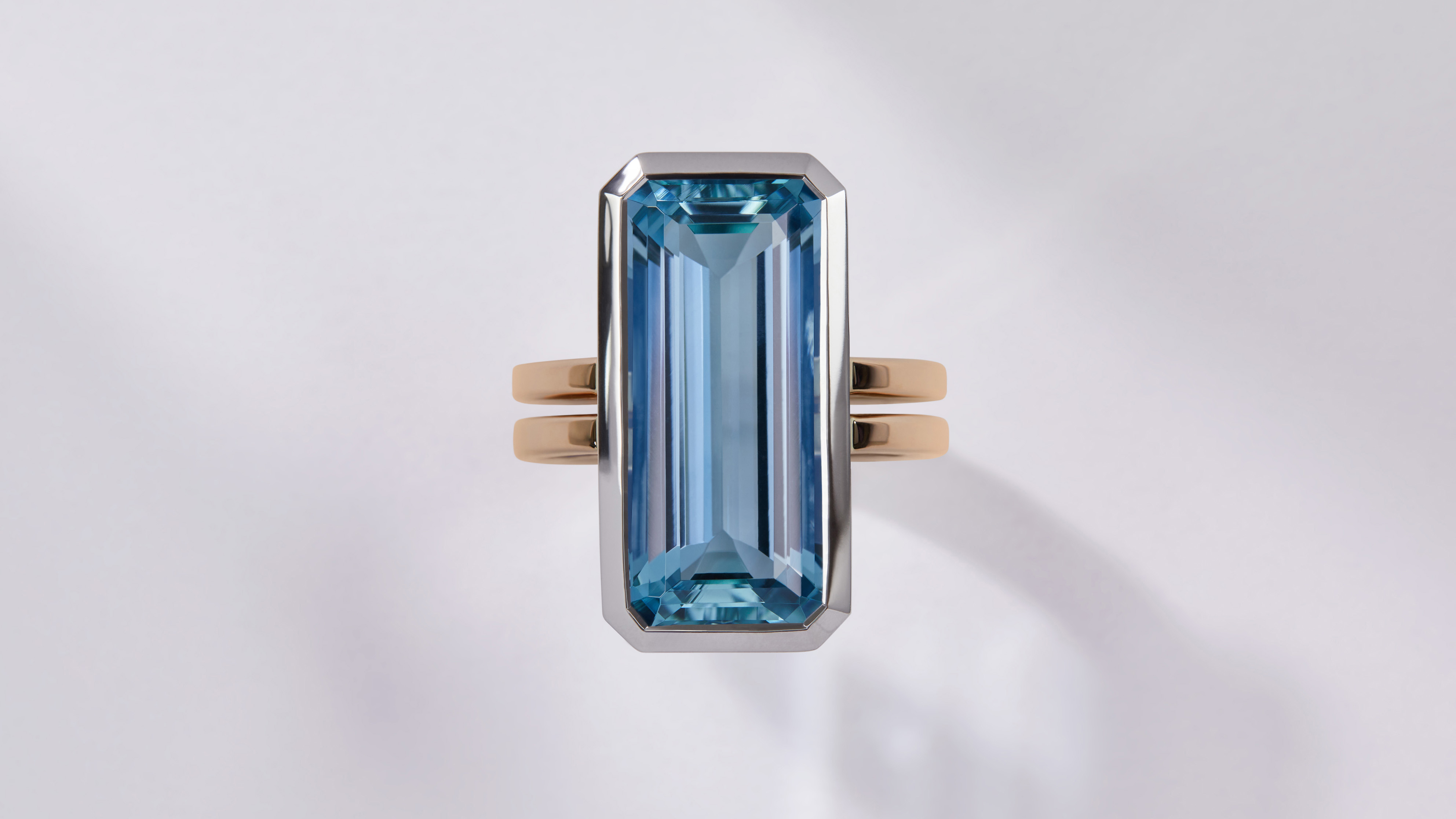 Aquamarine and pink sapphire ring in yellow gold and platinum.