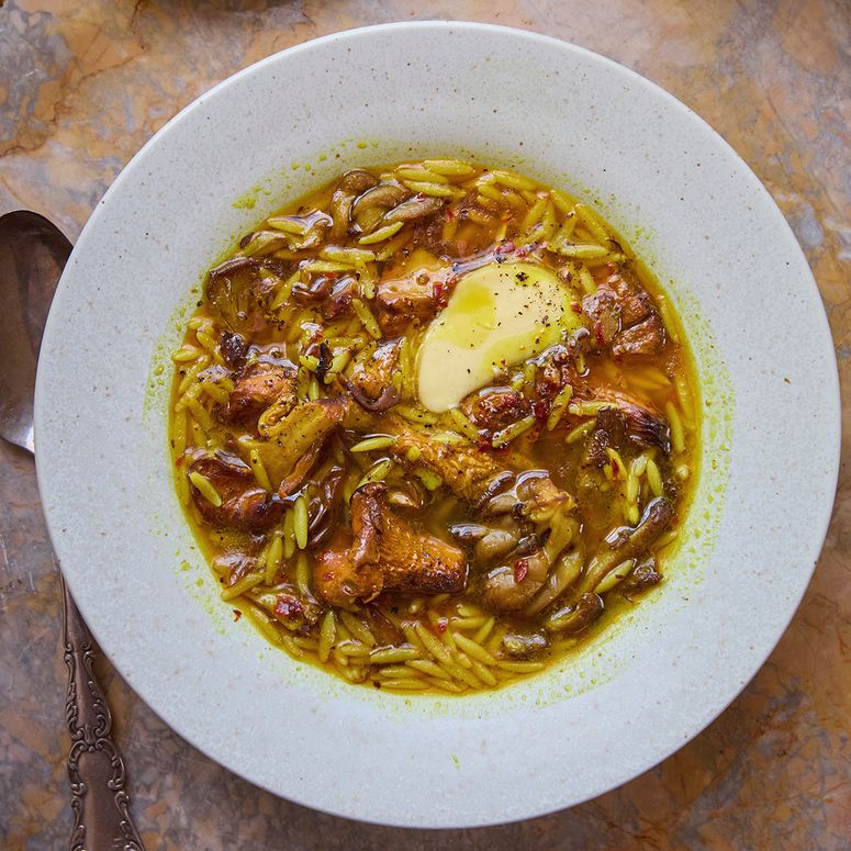 Golden mushroom soup in a white bowl