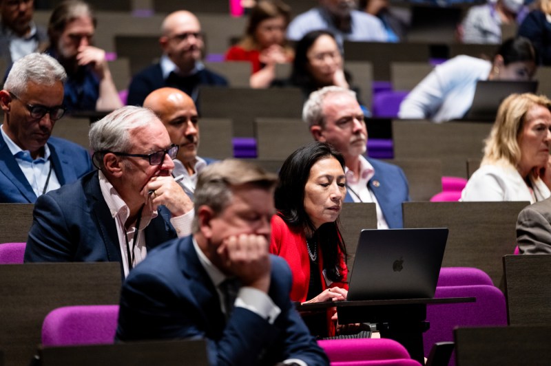 Attendees listen attentively and take notes during Northeastern University’s Senior Leadership Retreat at the ISEC auditorium.