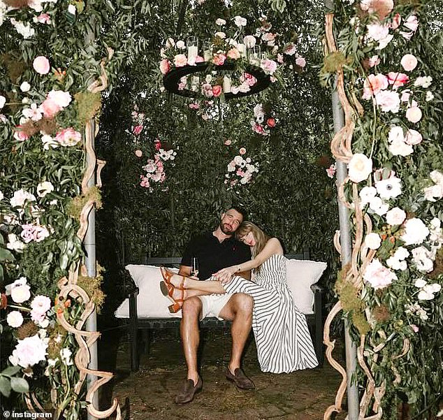 The loved-up couple pose for an photo in Kelce's garden immediately after their engagement