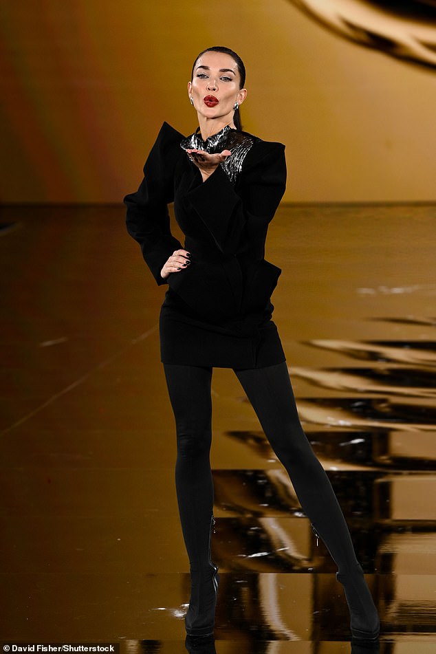 Amy Jackson exuded confidence in a fun all-black outfit as she blew a kiss to the guests in attendance for the show