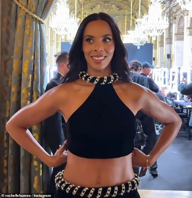 The longtime brand ambassador woed in a jewelled black and silver look, complete with a revealing halterneck crop top