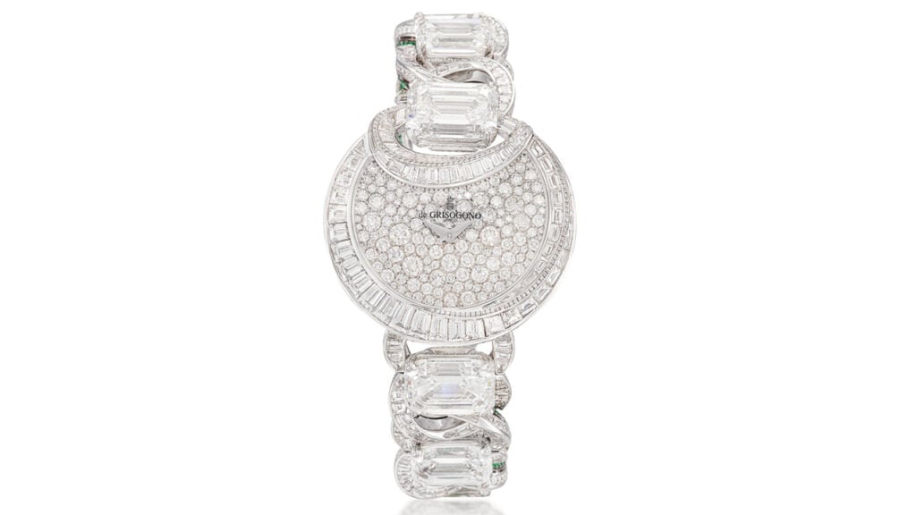 A de Grisogono Luna wristwatch has a half moon-shaped dial and bezel featuring brilliant-cut and baguette diamonds. The diamond-set, circular-link strap contains six principal step-cut diamonds, including a 7.10-carat one, as well as circular- and step-cut emeralds by Sotheby's image