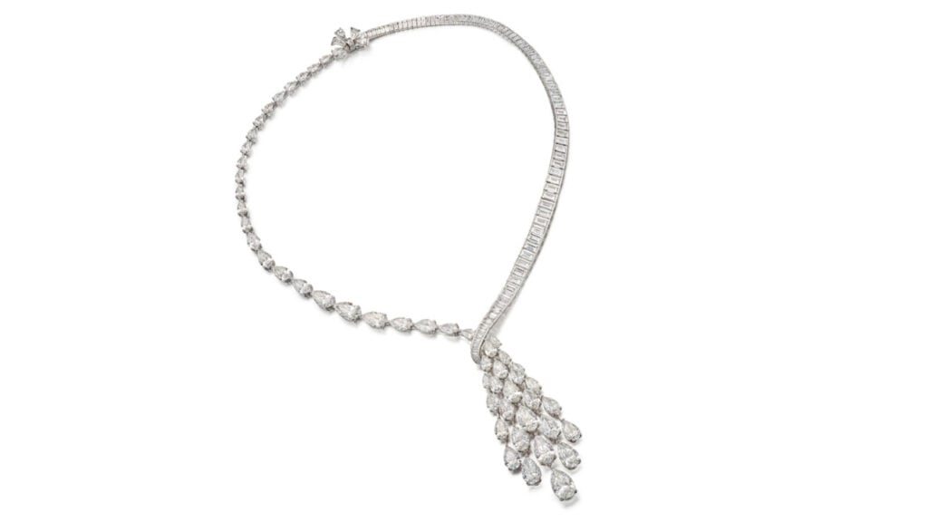This Graff necklace is designed as ribbons of graduated pear-shaped and baguette diamonds, supporting a tassel of pear-shaped diamonds, with stones weighing between 0.90 and 3.01 carats by Sotheby's image