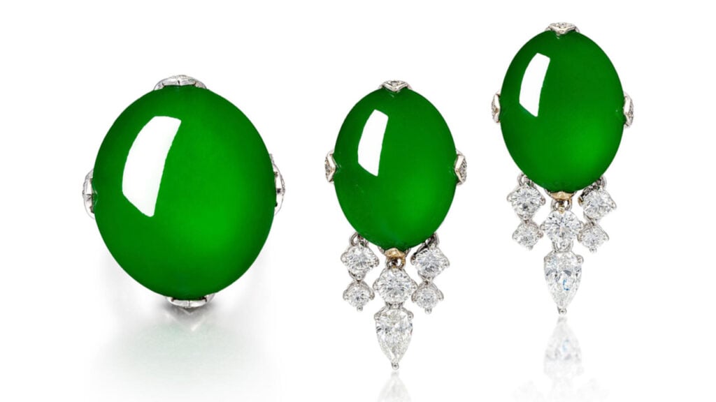 A set comprising a ring and earrings carrying oval translucent vivid-green jadeites, with the earrings sporting brilliant-cut diamonds by Sotheby's image