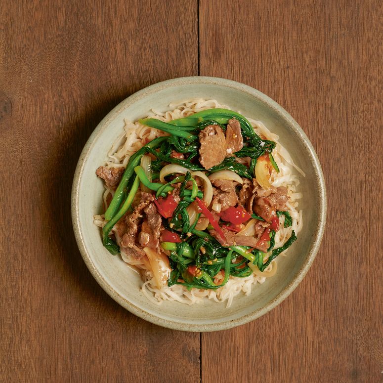 StirFried Pho Noodles With Beef in a bowl.