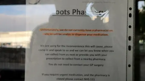 A sign on a door with a sentence highlighted in orange - "Unfortunately, due to a pharmacist not being available on site, we will not be able to dispense your medication."