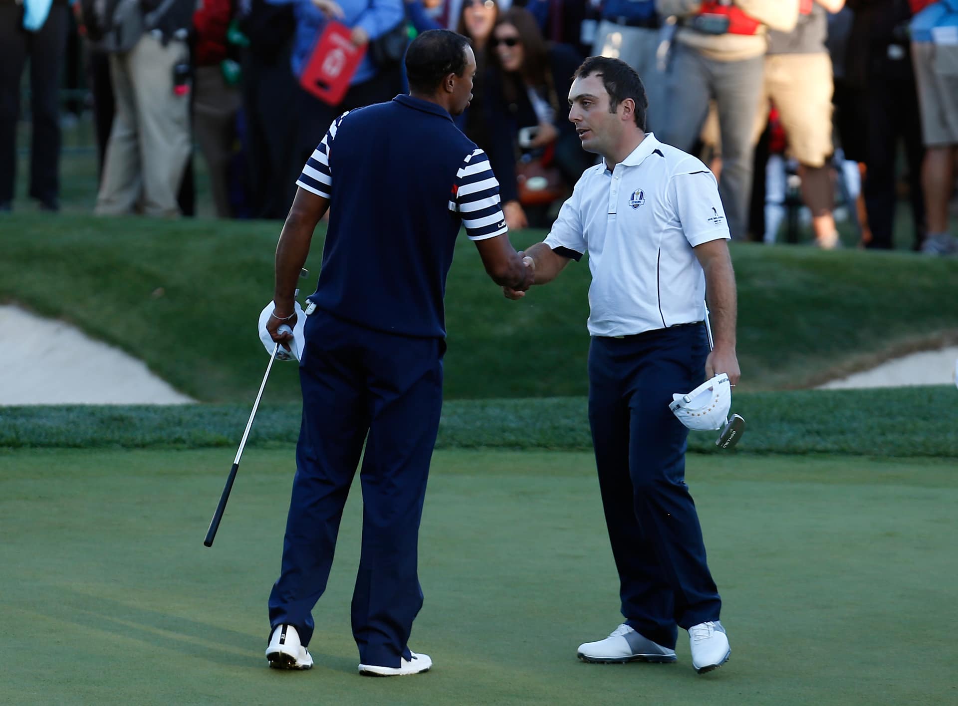 MEDINAH, IL - SEPTEMBER 30: Francesco Molinari of Europe (R) shakes hands with Tiger Woods of the USA on the 18th green after halving his match with Woods during the Singles Matches for The 39th Ryder Cup at Medinah Country Club on September 30, 2012 in Medinah, Illinois. (Photo by Jamie Squire/Getty Images)