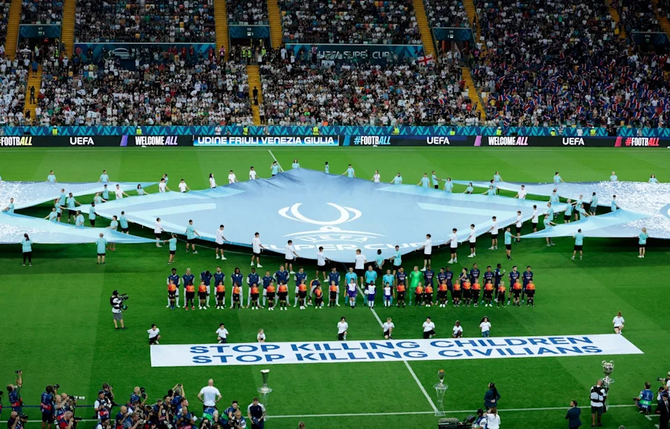 Banners reading ‘Stop killing children. Stop killing civilians’ were displayed before the Uefa Super Cup match between Tottenham and PSG last month (Reuters)
