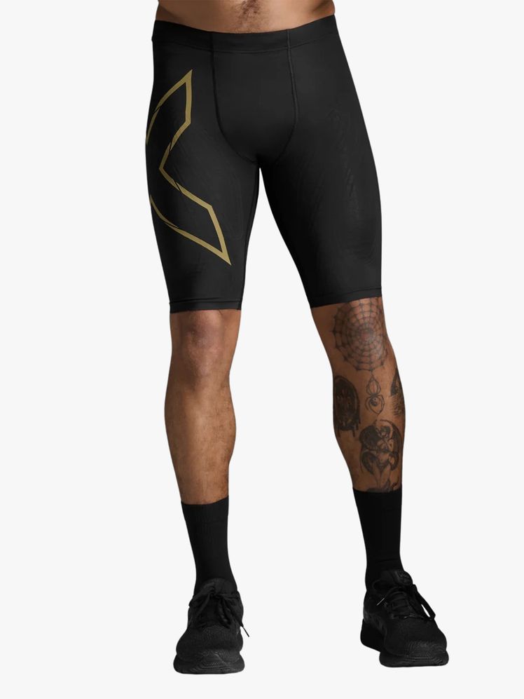 Model wearing compression shorts on a flat background.