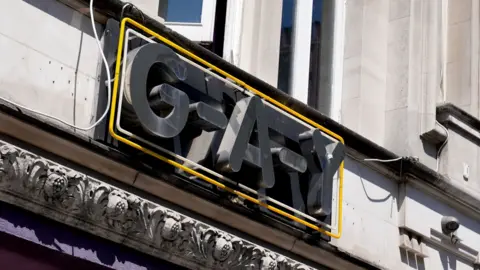 Getty Images The image is a close-up of a building's facade featuring a prominent sign that reads "G-A-Y."