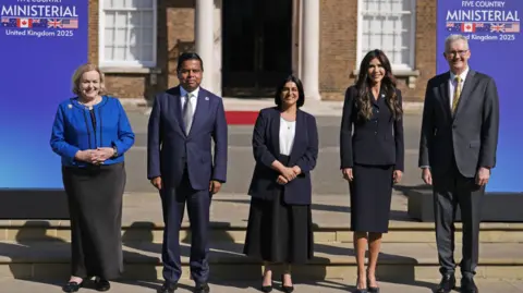 PA Media New Zealand minister Judith Collins, Minister of Public Safety of Canada Gary Anandasangaree, Home Secretary Shabana Mahmood, US Secretary of Homeland Security Kristi Noem and Minister for Home Affairs of Australia Tony Burke at a Five Country Ministerial meeting at the Honourable Artillery Company, Armoury House, in the City of London.