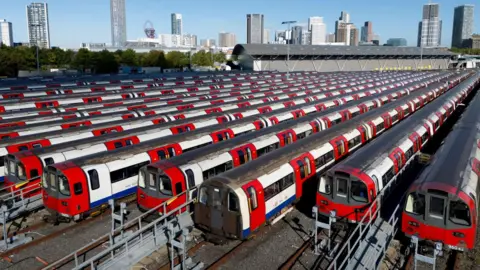 EPA An aerial view of several Tube trains stationary, parked at a depot.