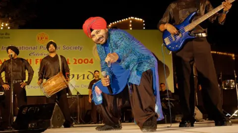 Getty Images Punjabi pop singer Daler Mehndi Performing during a stage show in New Delhi, India. 