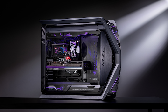 An ROG Gaming pc with an ROG OMNI figurine sitting on top of the graphics card