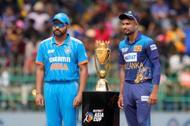 India's captain Rohit Sharma and his Sri Lankan counterpart Dasun Shanaka pose for photographs with trophy before the start of the Asia Cup final cricket match between India and Sri Lanka in Colombo, Sri Lanka, Sunday, Sep. 17, 2023. (AP Photo/Eranga Jayawardena)