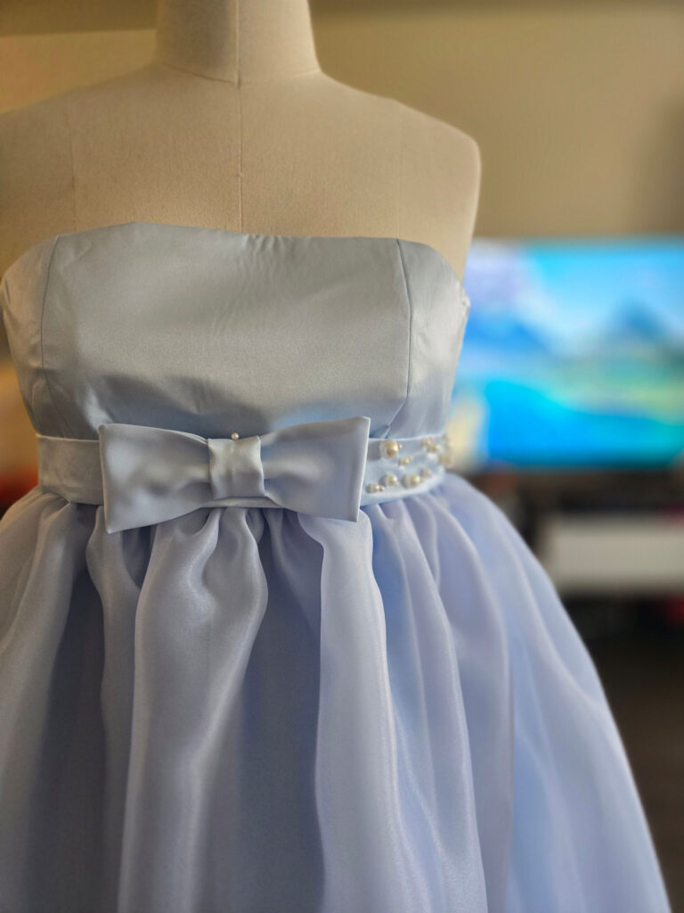 Closeup of a chiffon gown designed by Conway.