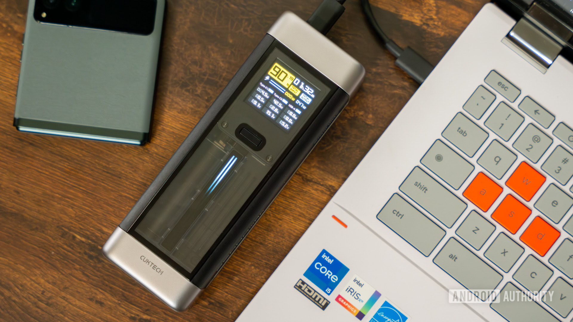 CUKTECH 20 Power Bank on table with other devices (4) CUKTECH 20 Power Bank on table with other devices (4)