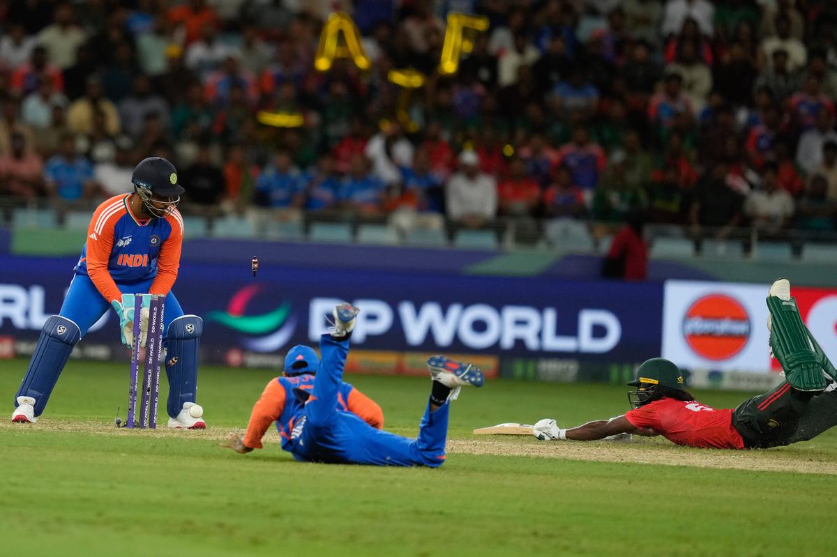 India's captain Suryakumar Yadav, second from left, successfully run out Bangladesh's Jaker Ali, right, during the Asia Cup cricket match between India and Bangladesh at Dubai International Cricket Stadium in Dubai, United Arab Emirates, Wednesday, Sept. 24, 2025. (AP Photo/Altaf Qadri )