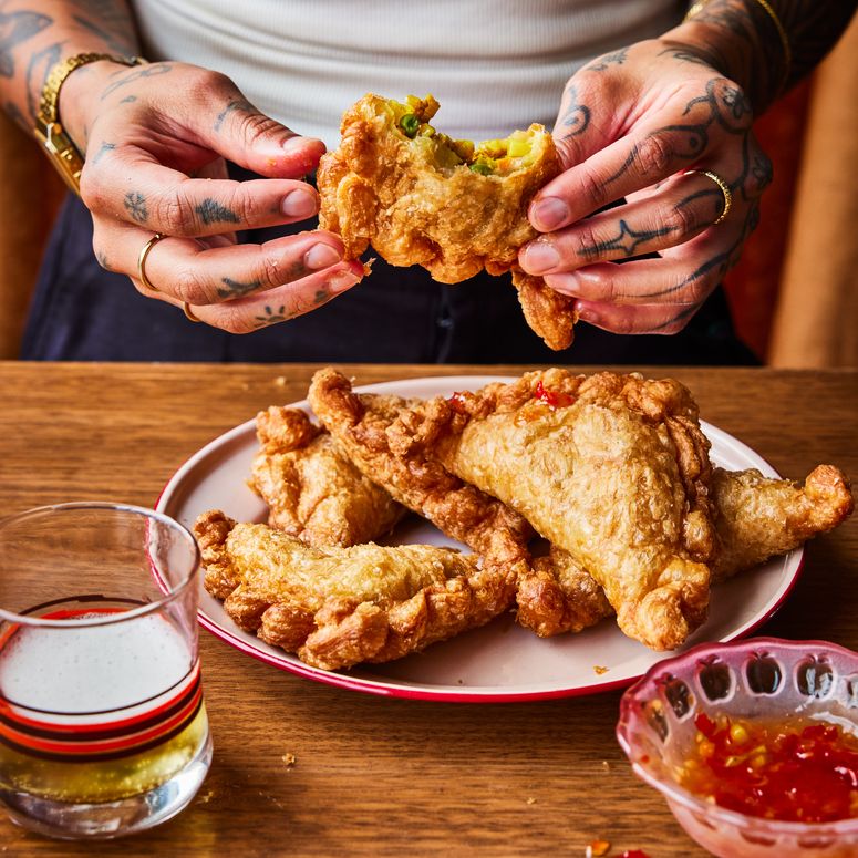 Eating Thai Curry Puff  on a plate