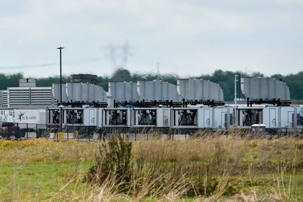 Gas turbines are visible at the xAI data center on April 25 in Memphis, Tenn. Credit: Brandon Dill/The Washington Post via Getty Images