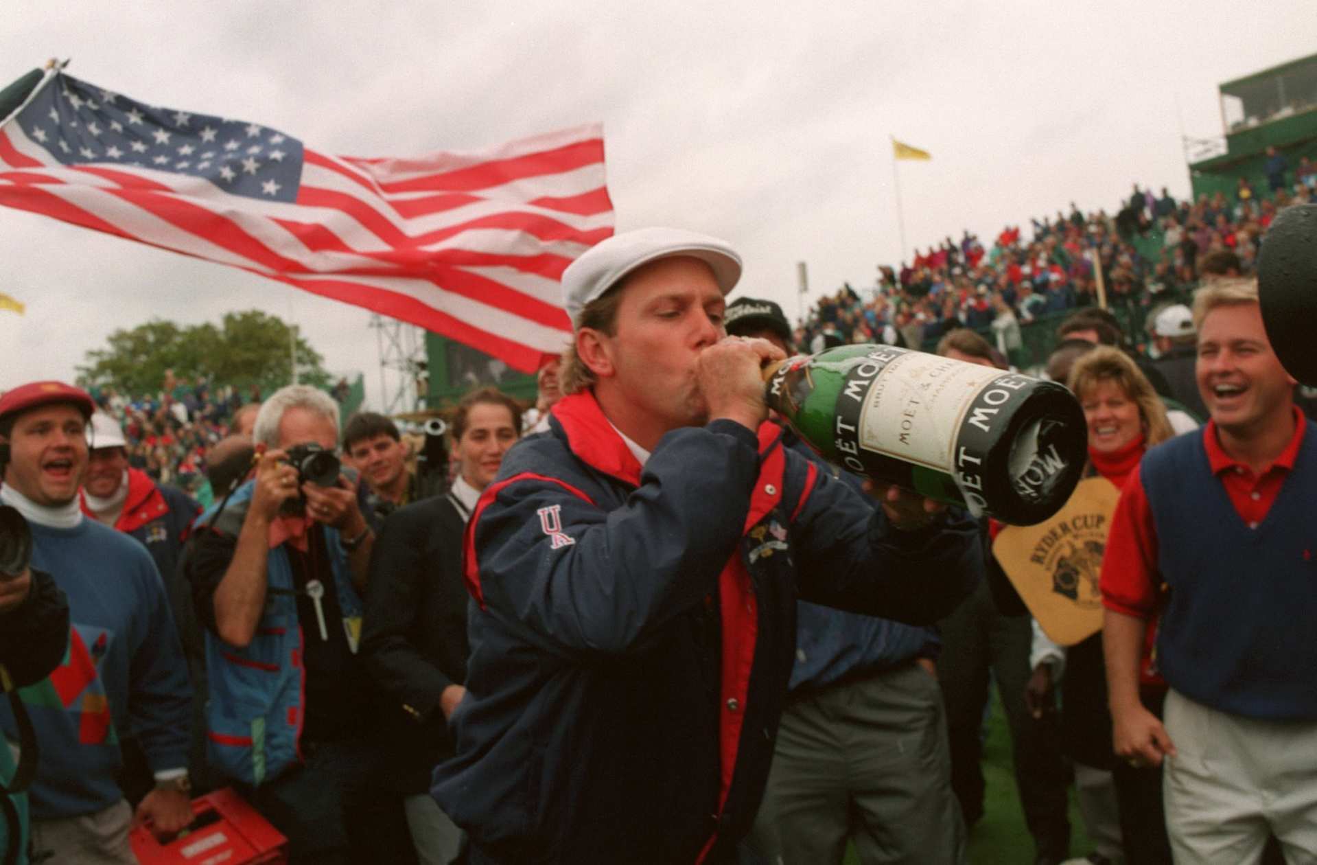 Payne Stewart, USA celebrates with a bottle of champagne (Photo by Graham Chadwick/EMPICS via Getty Images)