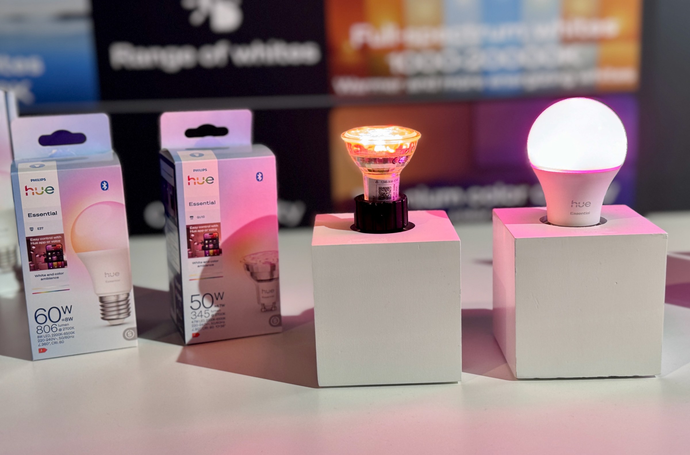 Two glowing smart light bulbs from Philips Hue’s new Essential lineup.