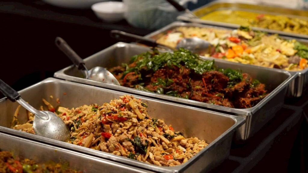 Thai curry rice trays close-up – Variety of spicy stir-fried and curry dishes served at the competition.