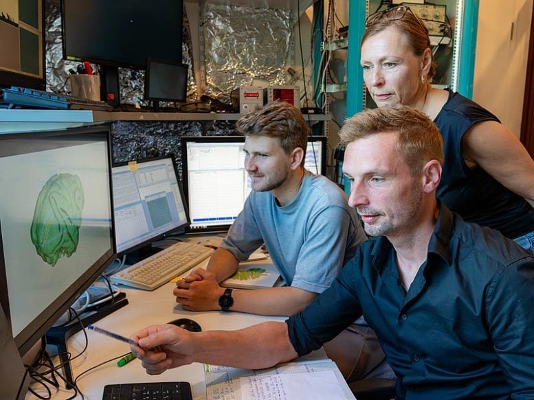 Peter Bujotzek, Dr. Eric Drebitz and His Team Reviewing Research Findings