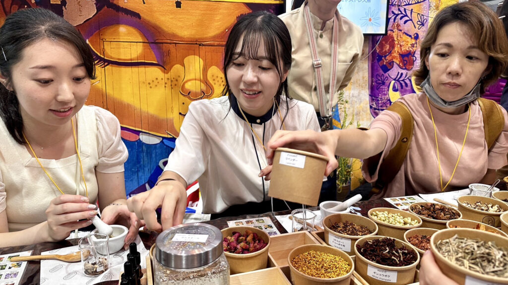 Japanese visitors joining Thai wellness and herbal workshop at Thailand Pavilion, Tourism Expo Japan 2025
