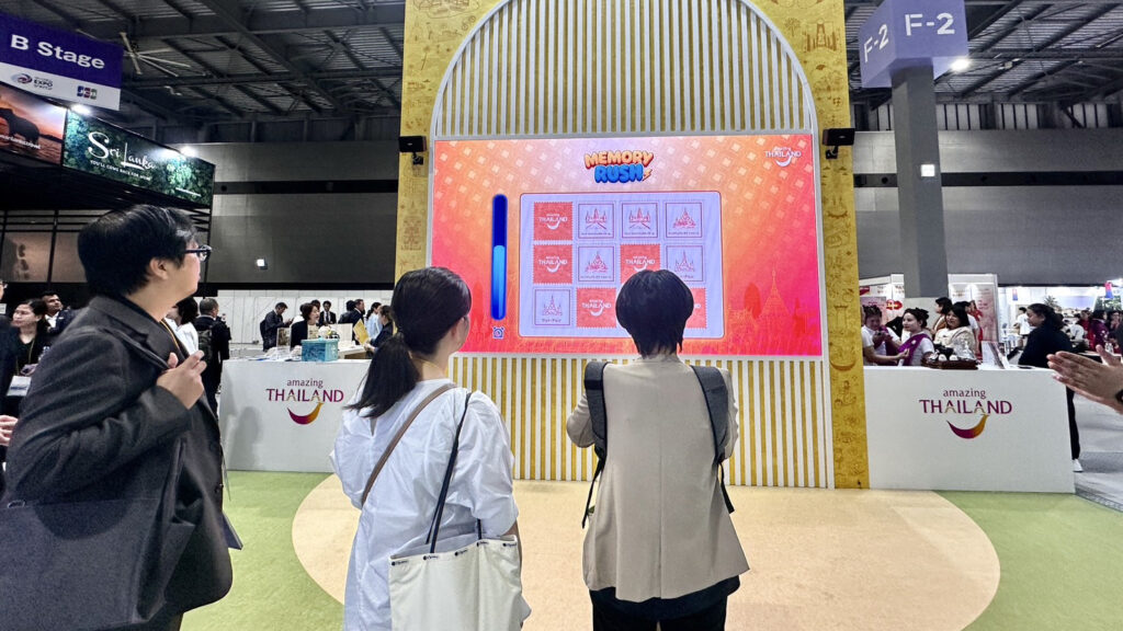Visitors playing interactive digital game at Thailand Pavilion, Tourism Expo Japan 2025