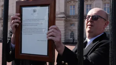PA Media The death announcement was attached to the gates outside Buckingham Palace