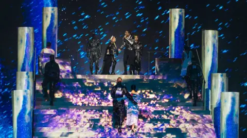 Getty Images Dancers for Madonna displaying flags of both Israel and Palestine on their backs during the star's guest performance at Eurovision 2019 in Tel Aviv
